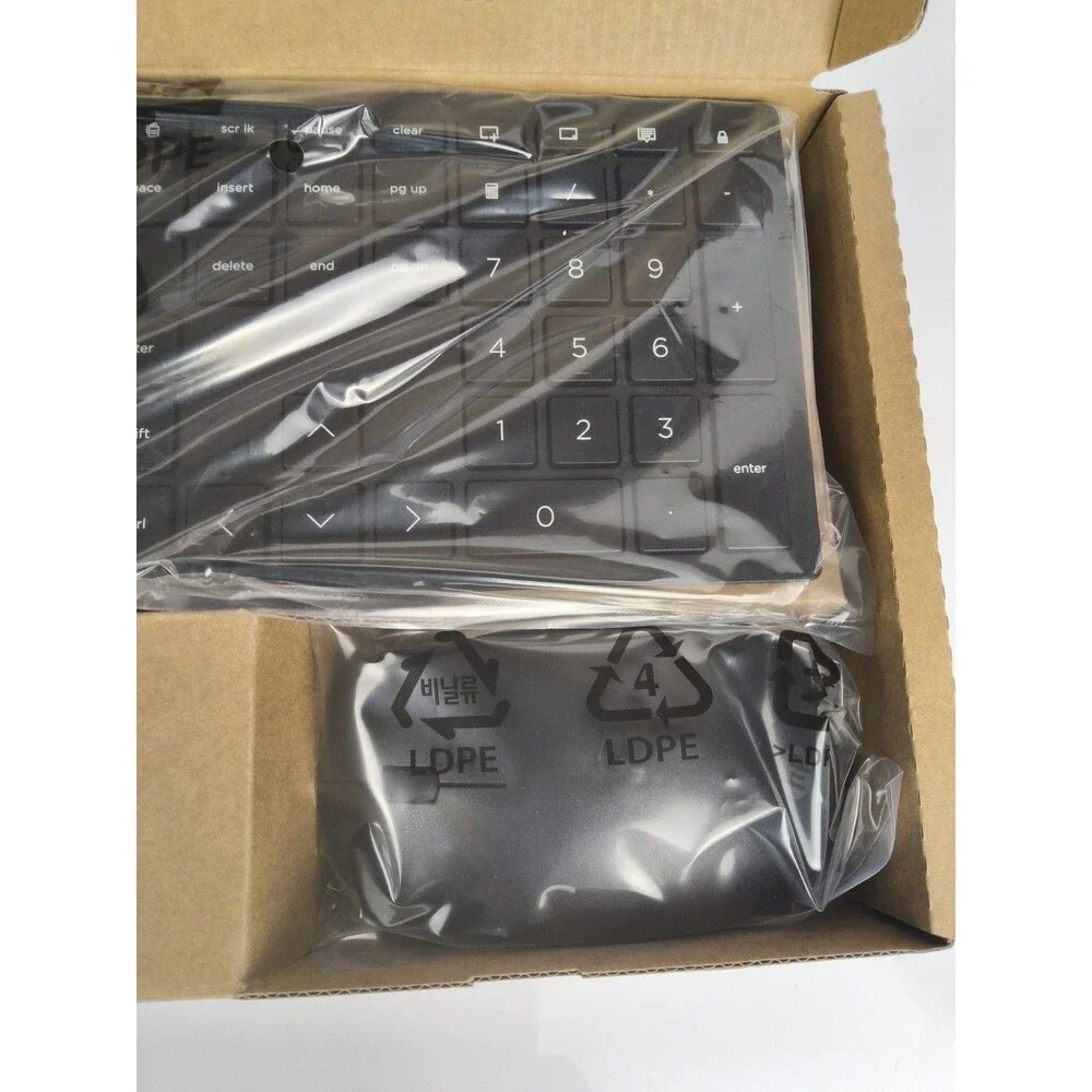 Slim Keyboard and wireless mouse Never used still in box with plastic